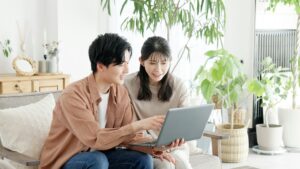 Couples browsing real estate and travel sites